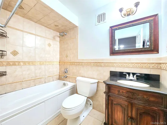 a bathroom with a sink a toilet and a bathtub