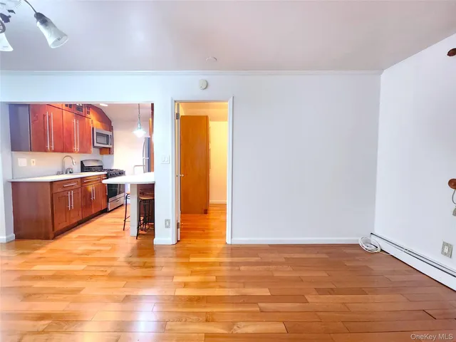 a view of kitchen with wooden floor
