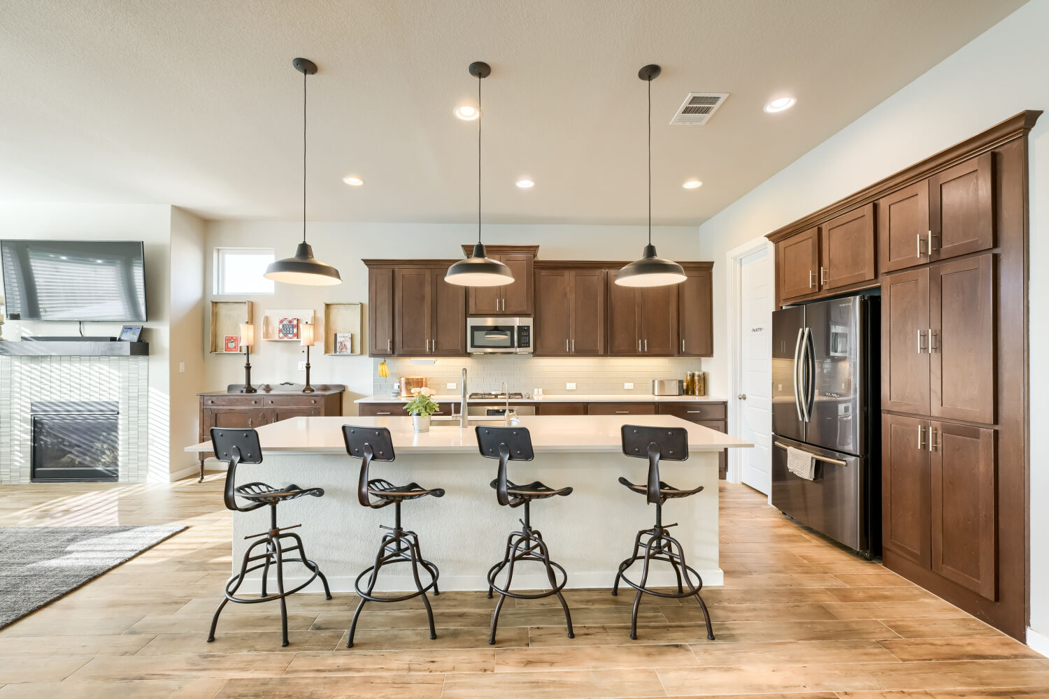 621 Rancho Sienna Loop Georgetown, TX 78628 - Photo 7 of 28 Culinary adventures await in this kitchen, boasting an island, recessed lights, and stainless steel appliances.