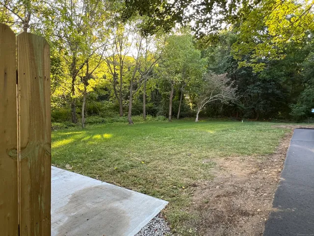 a view of a backyard with green space