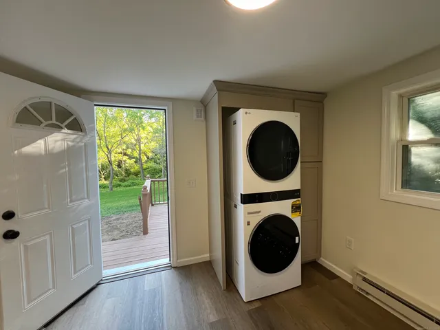 a view of a hallway with washer and dryer