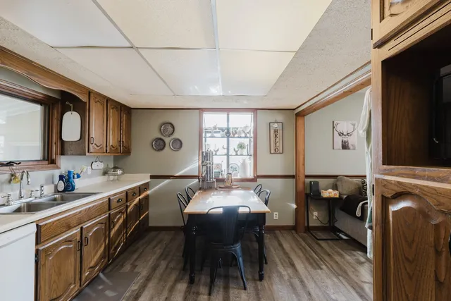 a spacious bathroom with double vanity a bathtub and mirrors