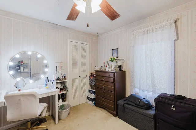 a room with a baby crib furniture and a dresser