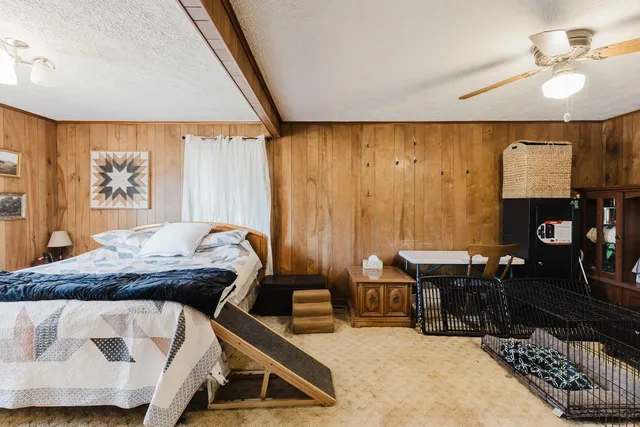 a bed room with a bed and a fish tank