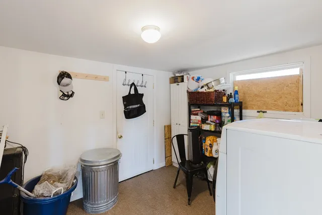 a view of a workspace with furniture and a gate