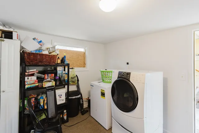 a view of a storage & utility room with washer and dryer