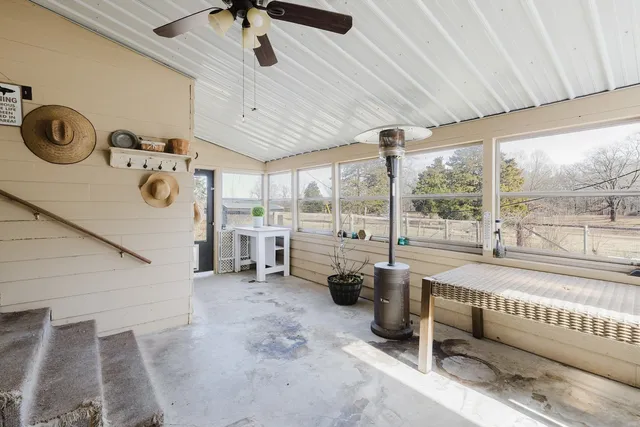 a bed room with a bed and a large window