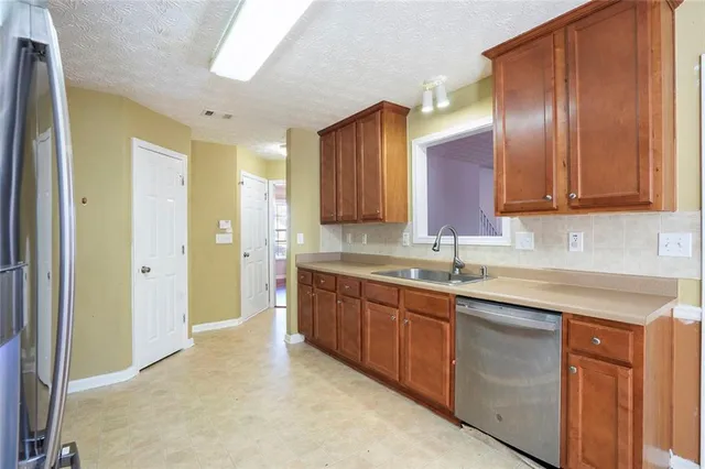 a kitchen with a sink and cabinets