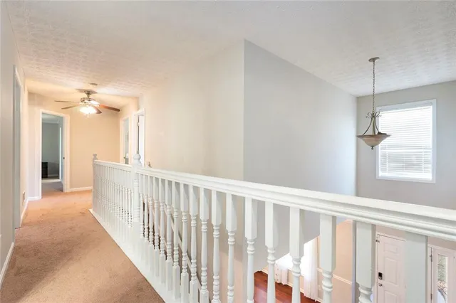 a view of a hallway with windows