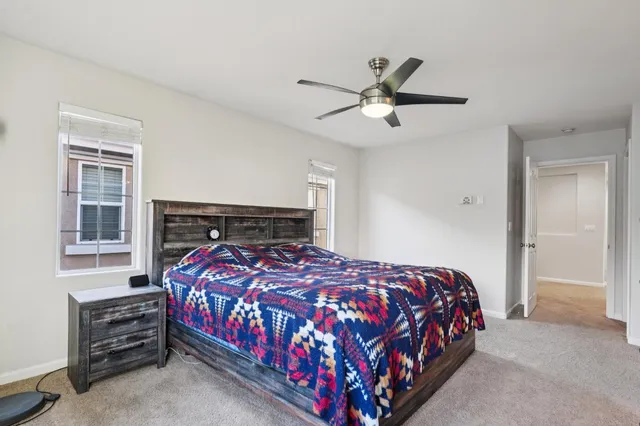 a bedroom with a bed and window