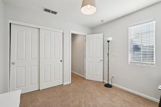 a view of backyard with wheel chair and potted plants
