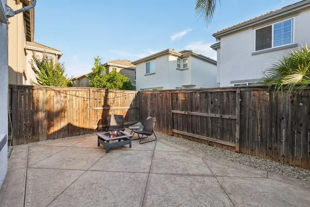a view of a balcony with chair and front door