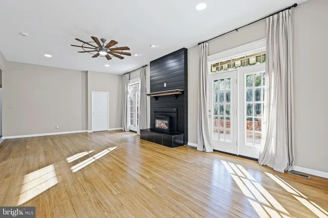 a kitchen with granite countertop a sink a stove and refrigerator