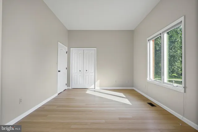 a view of an empty room with a window