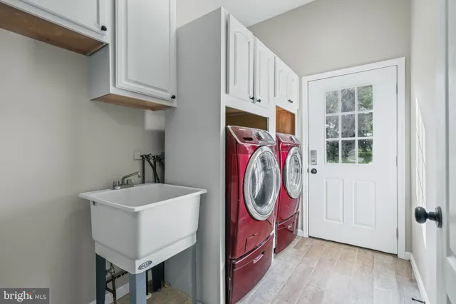 a bathroom with a sink mirror and toilet