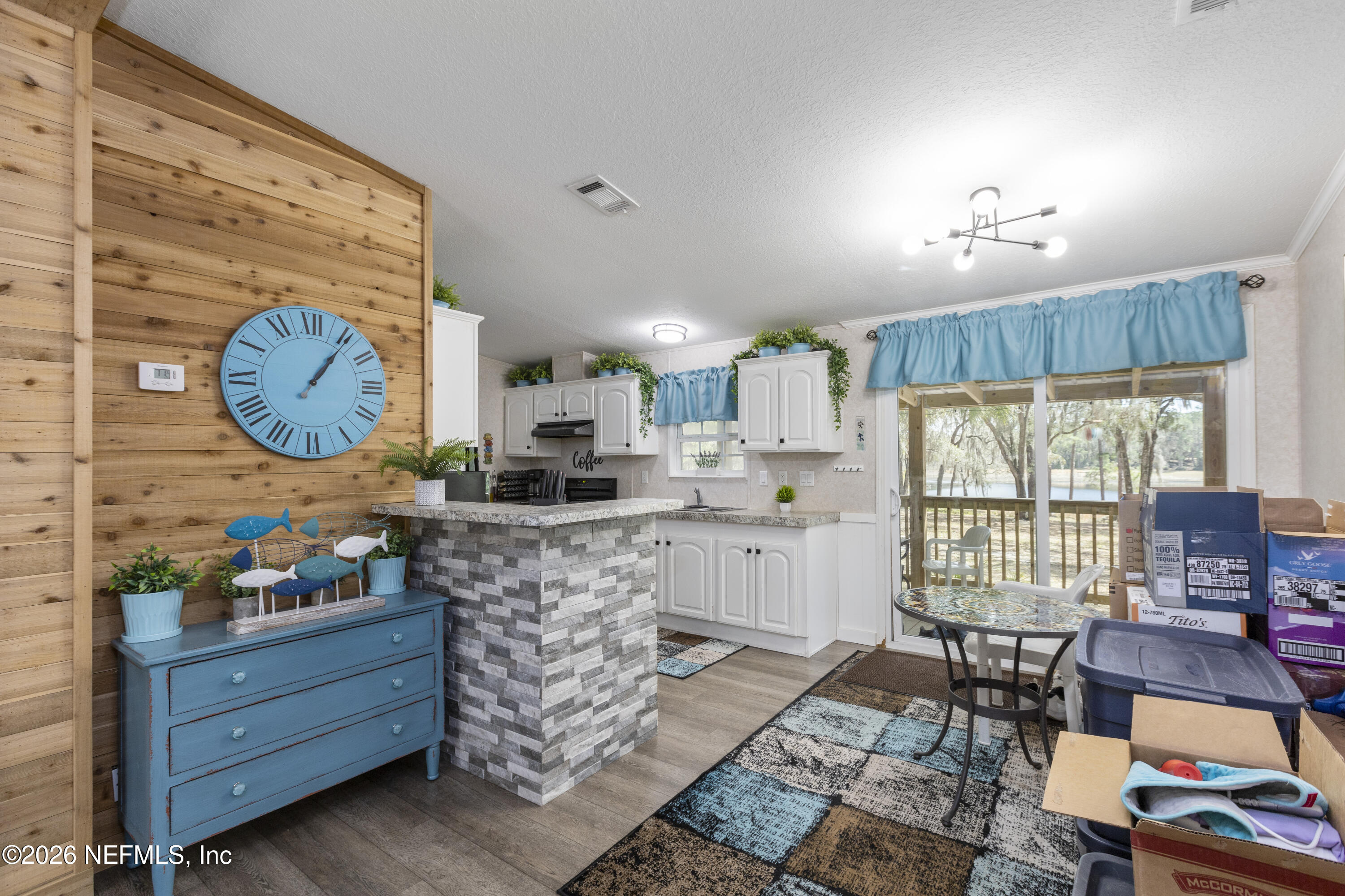 167 West Strickland Road Interlachen, FL 32148 - Photo 11 of 59 a large room with lots of wooden furniture and a window