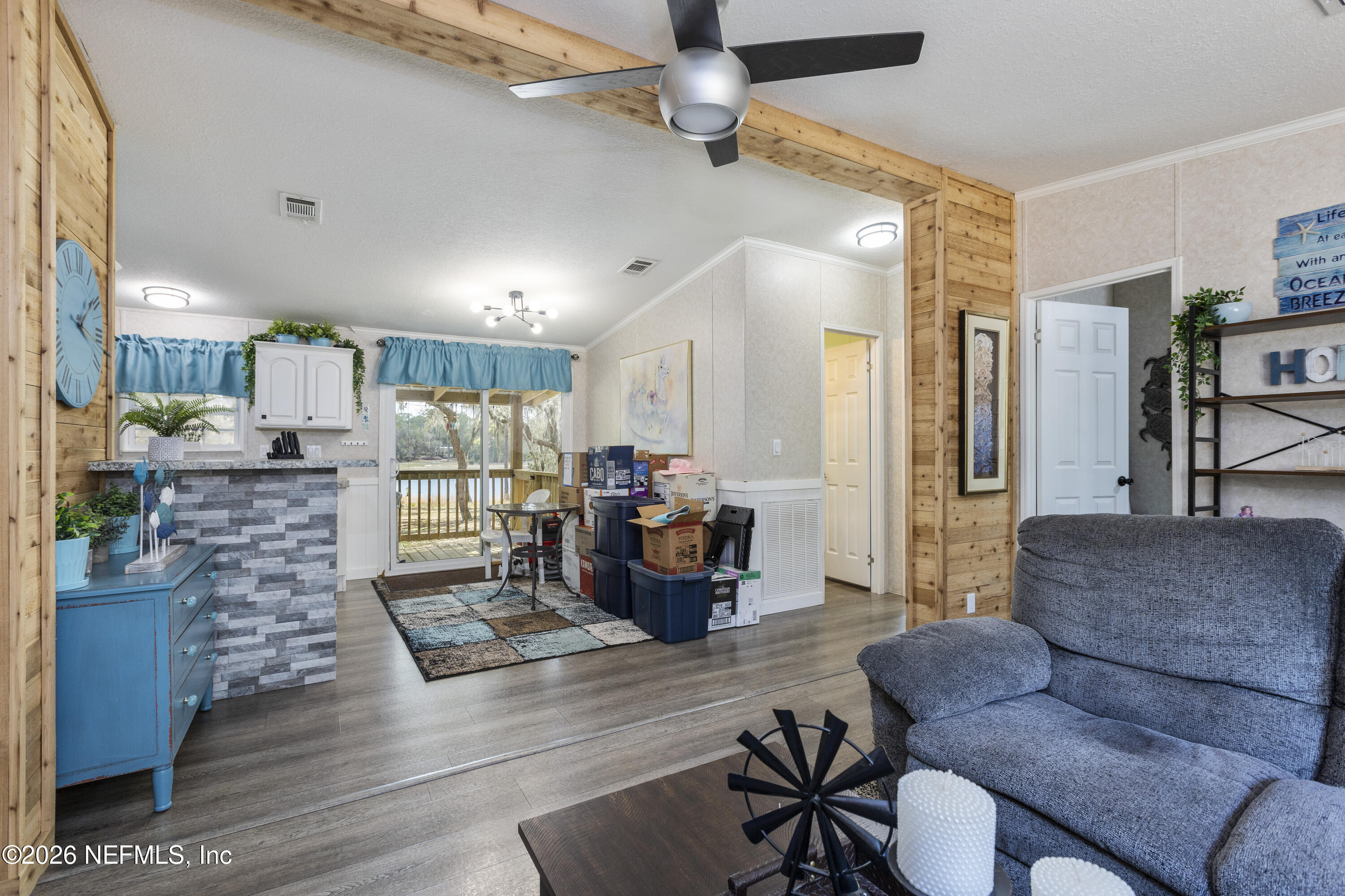 167 West Strickland Road Interlachen, FL 32148 - Photo 17 of 59 a living room with furniture and a wooden floor
