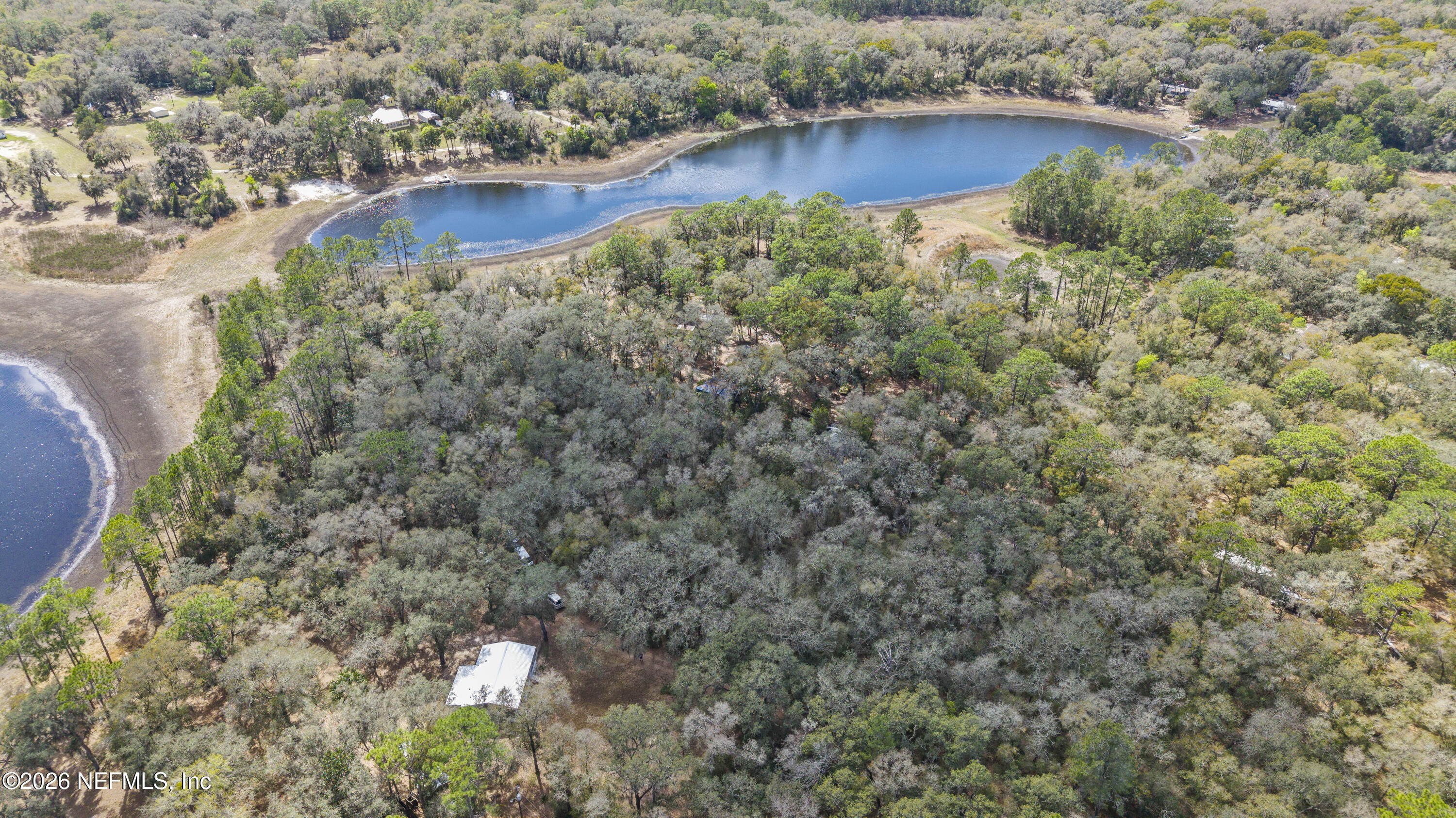 167 West Strickland Road Interlachen, FL 32148 - Photo 23 of 59 a view of a house with a yard and sitting area