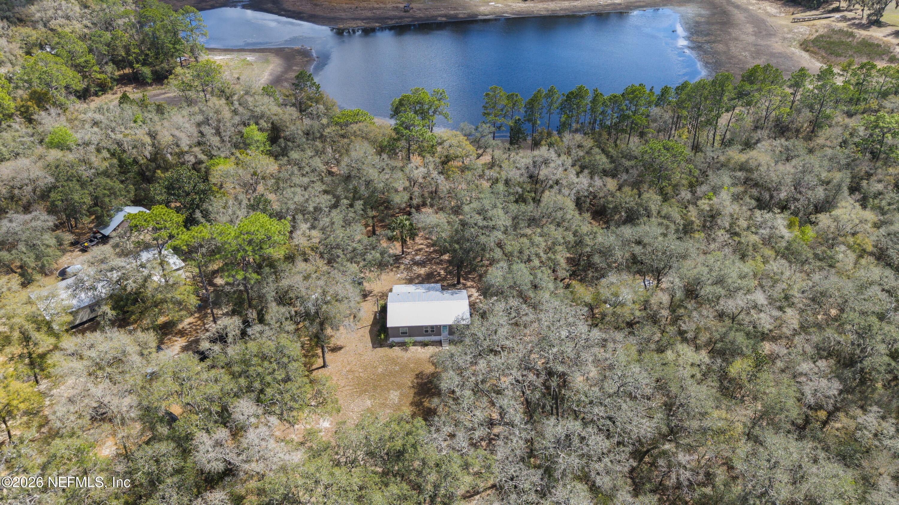 167 West Strickland Road Interlachen, FL 32148 - Photo 25 of 59 a view of a house with a yard
