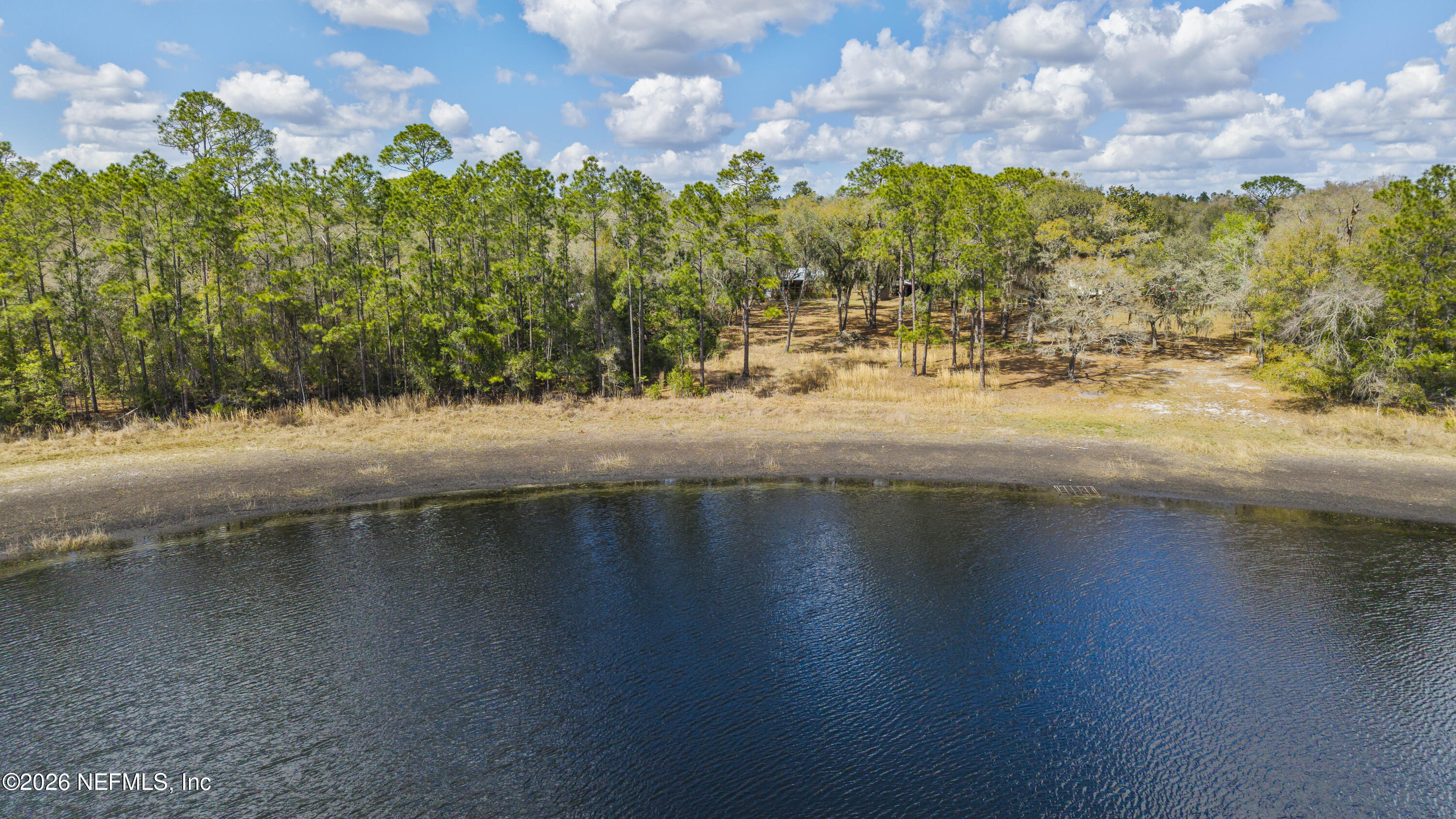 167 West Strickland Road Interlachen, FL 32148 - Photo 26 of 59 a view of a lake with a yard