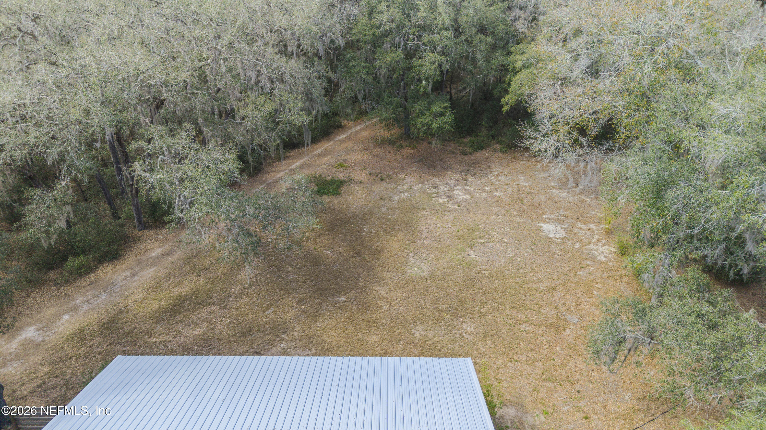 167 West Strickland Road Interlachen, FL 32148 - Photo 33 of 59 a view of a dry yard with wooden fence