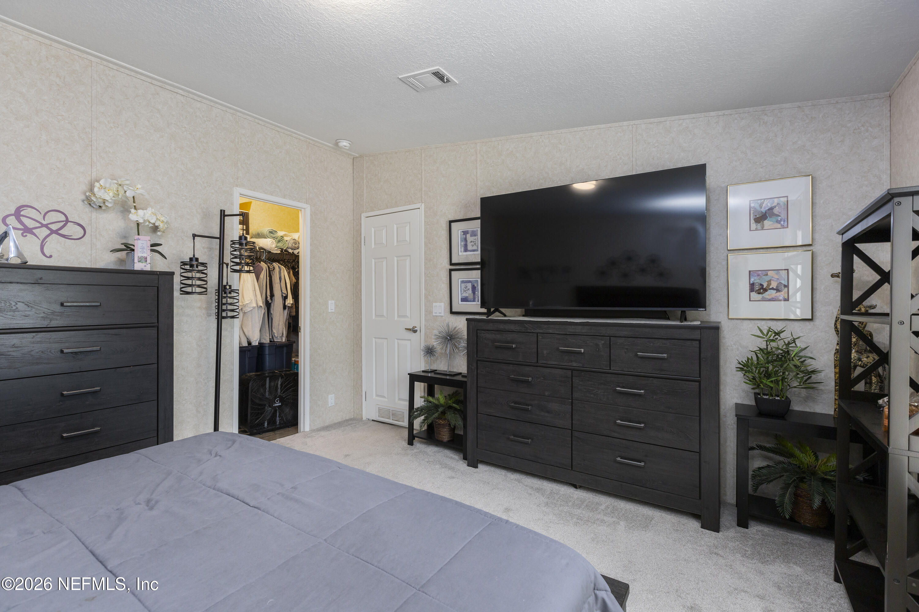 167 West Strickland Road Interlachen, FL 32148 - Photo 35 of 59 a room with furniture and flat screen tv