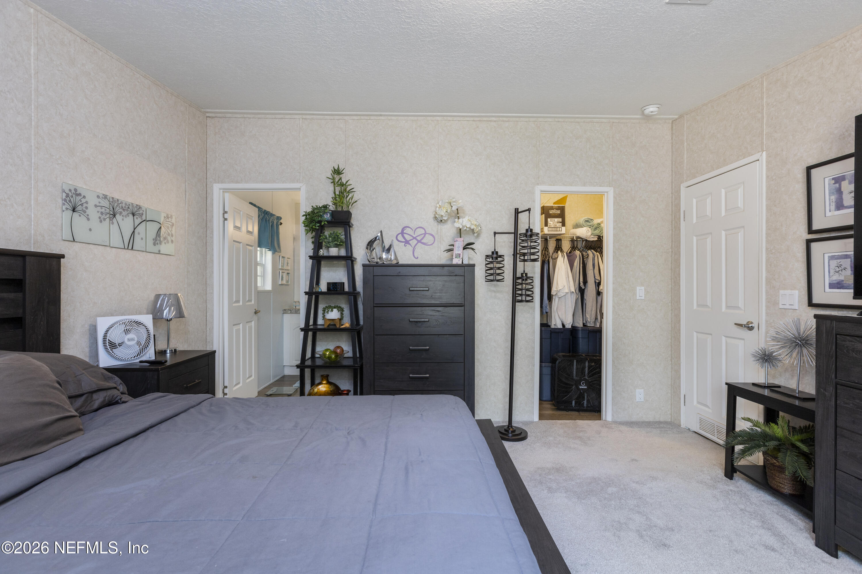 167 West Strickland Road Interlachen, FL 32148 - Photo 36 of 59 a bed room with a bed and a cabinets