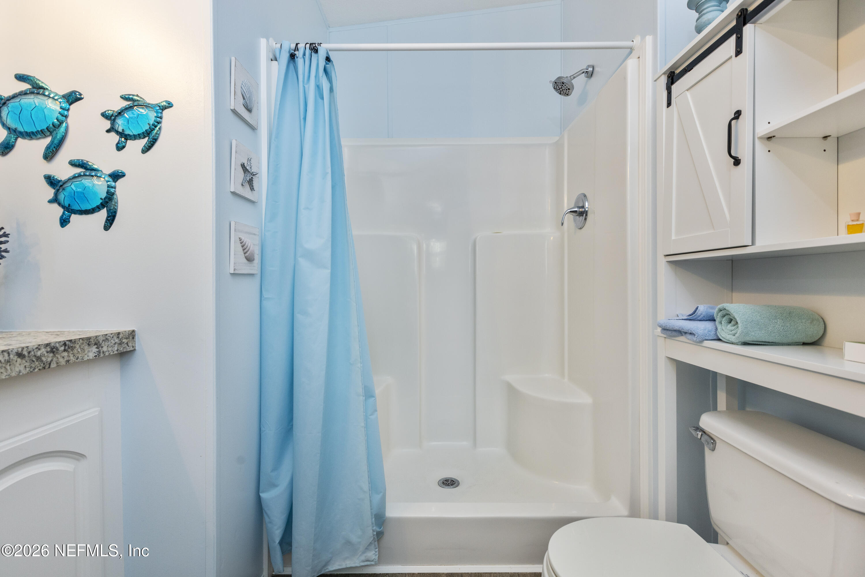 167 West Strickland Road Interlachen, FL 32148 - Photo 40 of 59 a bathroom with a shower a toilet and a sink