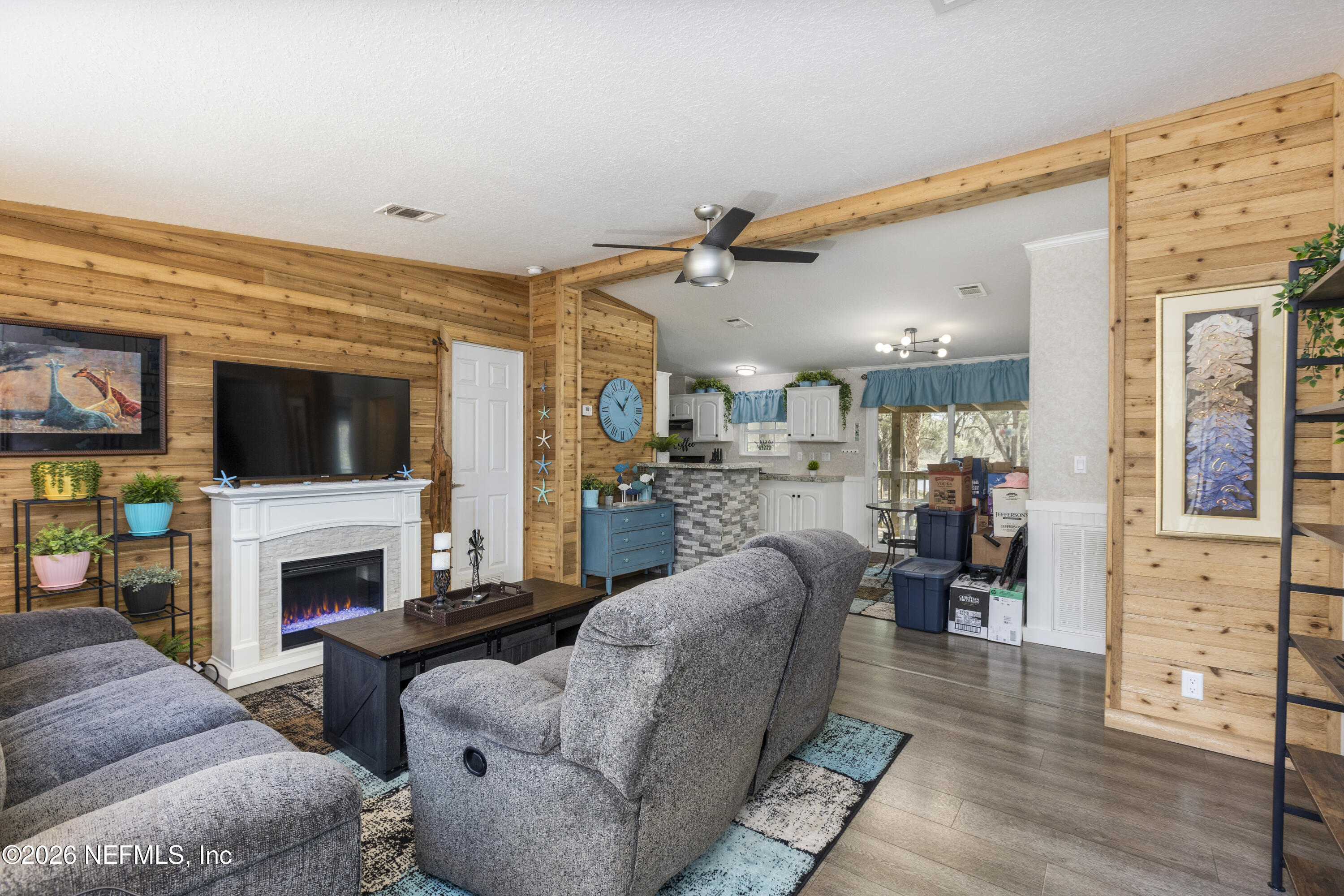 167 West Strickland Road Interlachen, FL 32148 - Photo 4 of 59 a living room with furniture and a fireplace