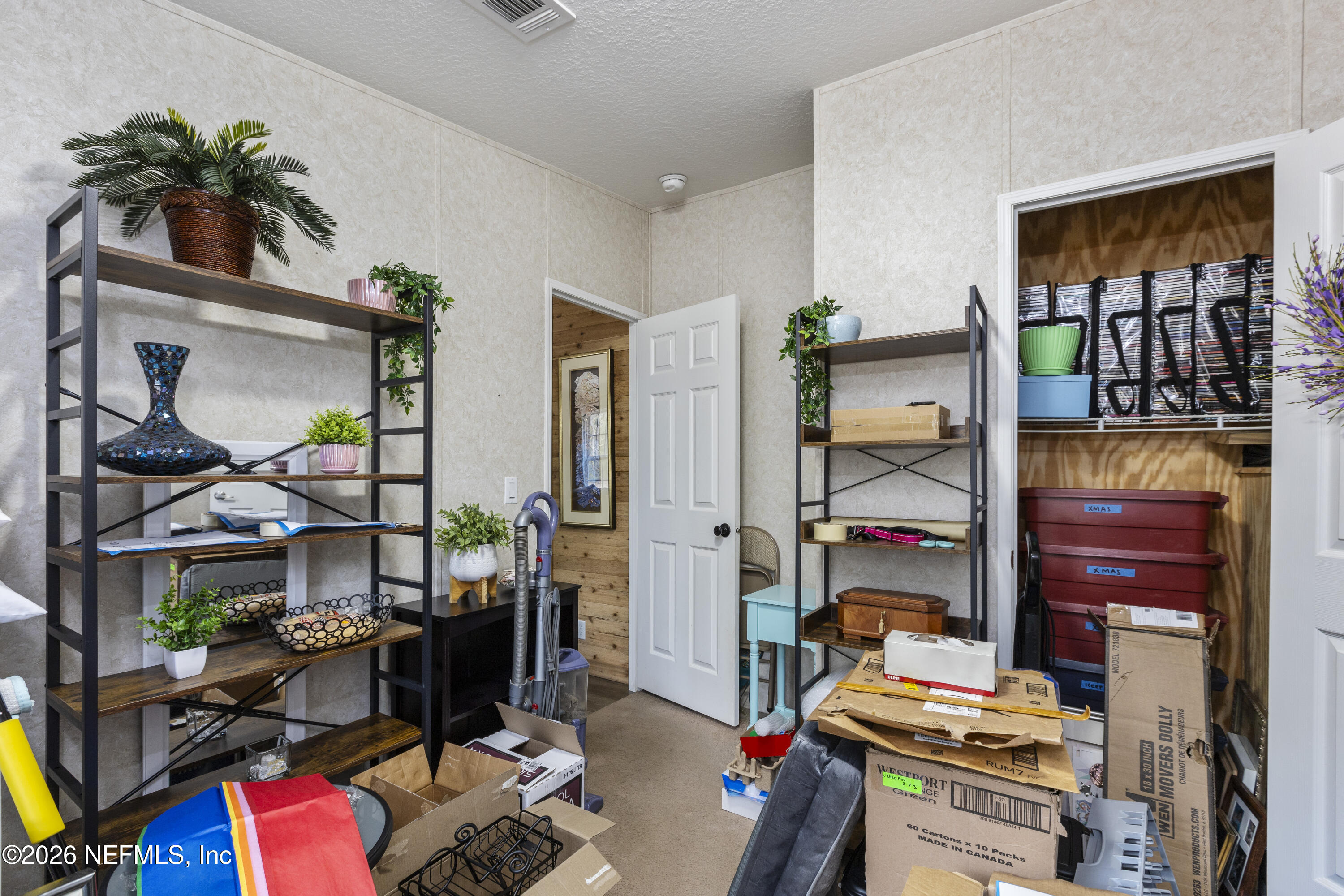 167 West Strickland Road Interlachen, FL 32148 - Photo 46 of 59 a living room with furniture and a potted plant