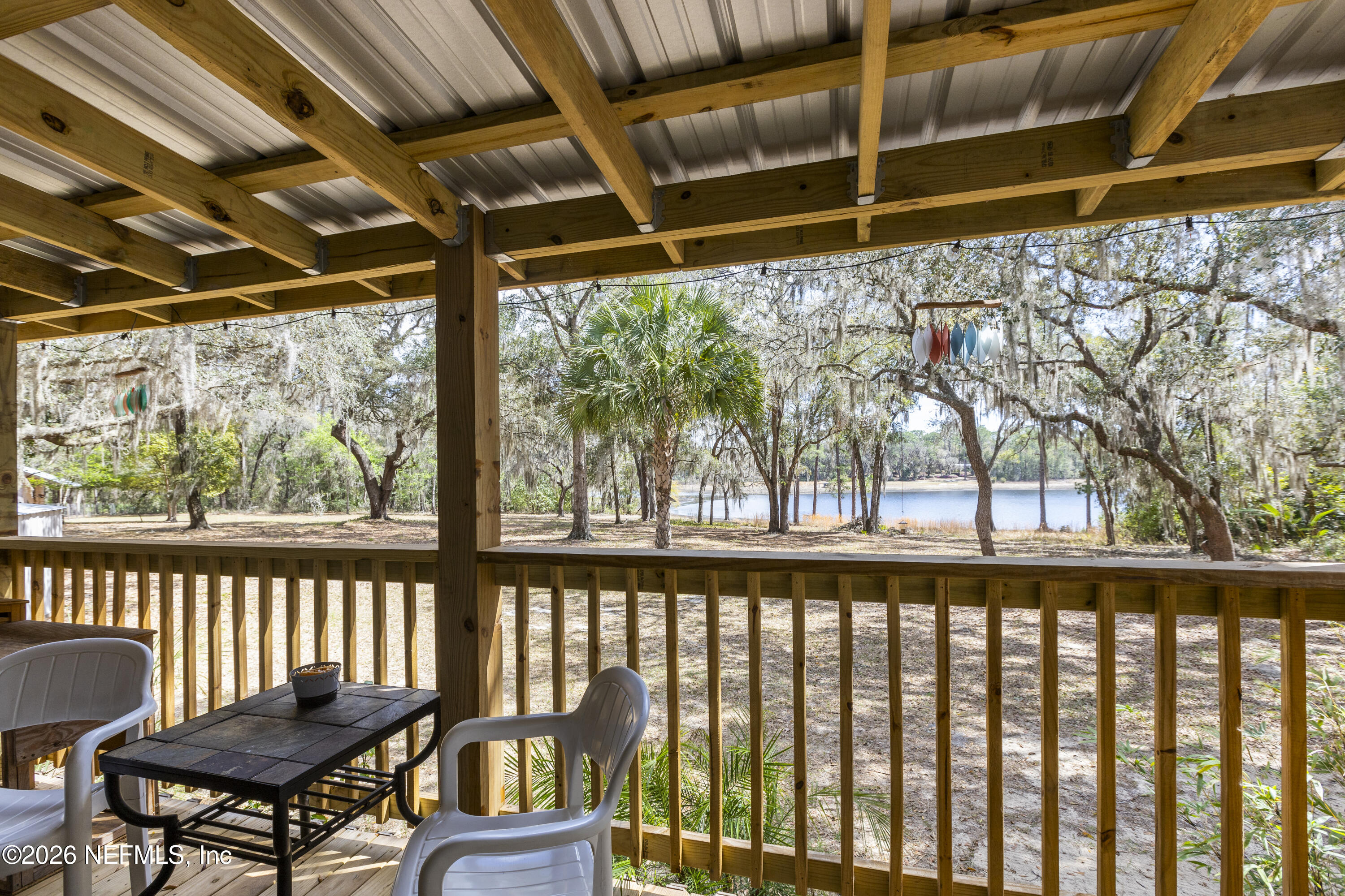 167 West Strickland Road Interlachen, FL 32148 - Photo 49 of 59 a view of a chairs and table in the outdoor room