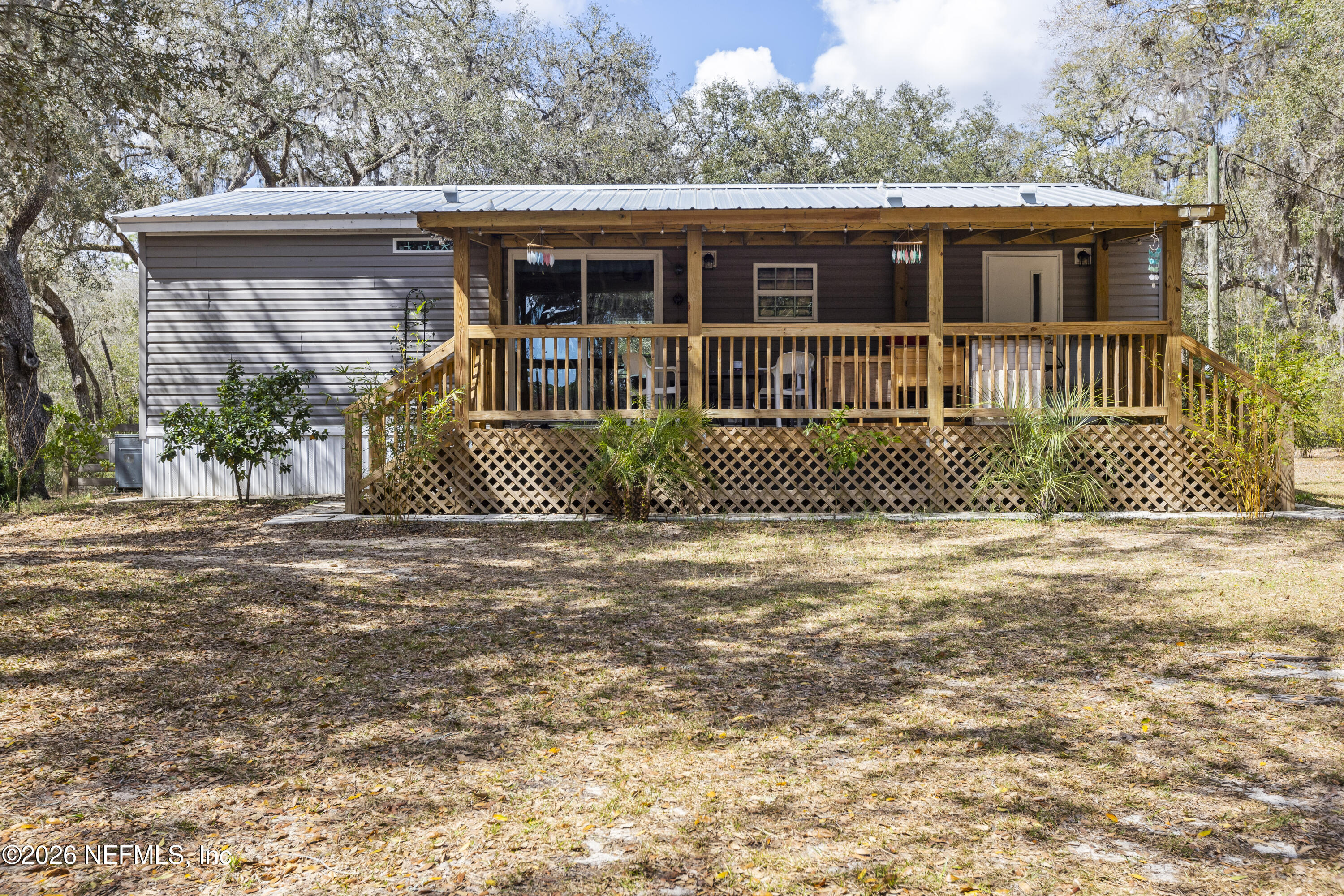 167 West Strickland Road Interlachen, FL 32148 - Photo 51 of 59 a front view of a house with a yard
