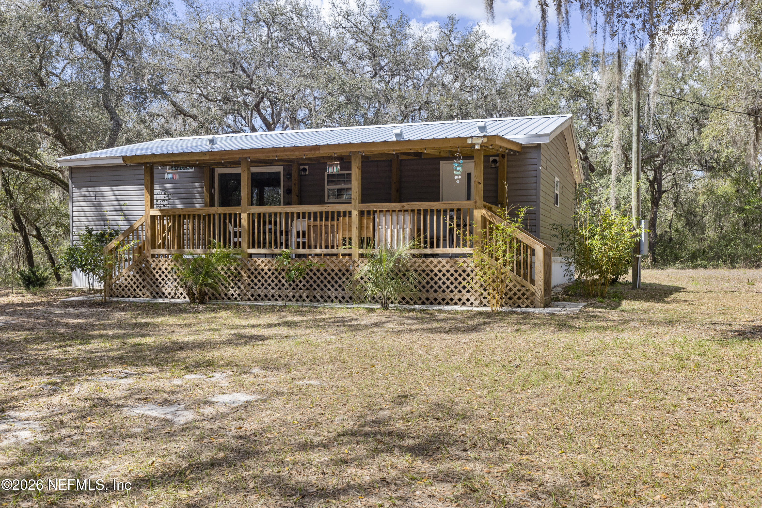 167 West Strickland Road Interlachen, FL 32148 - Photo 52 of 59 a front view of a house with a yard