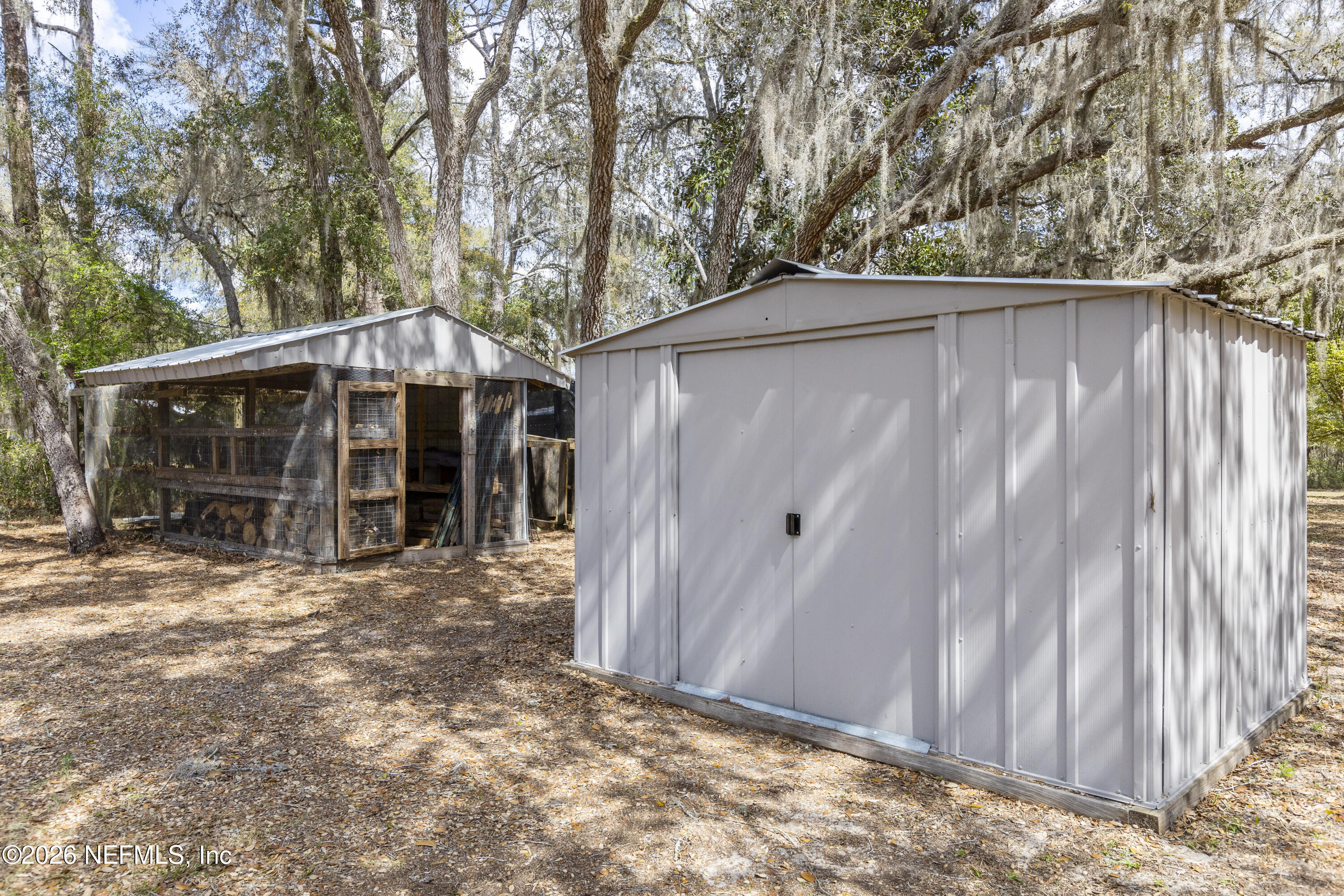 167 West Strickland Road Interlachen, FL 32148 - Photo 53 of 59 a view of a house with a yard and wooden fence