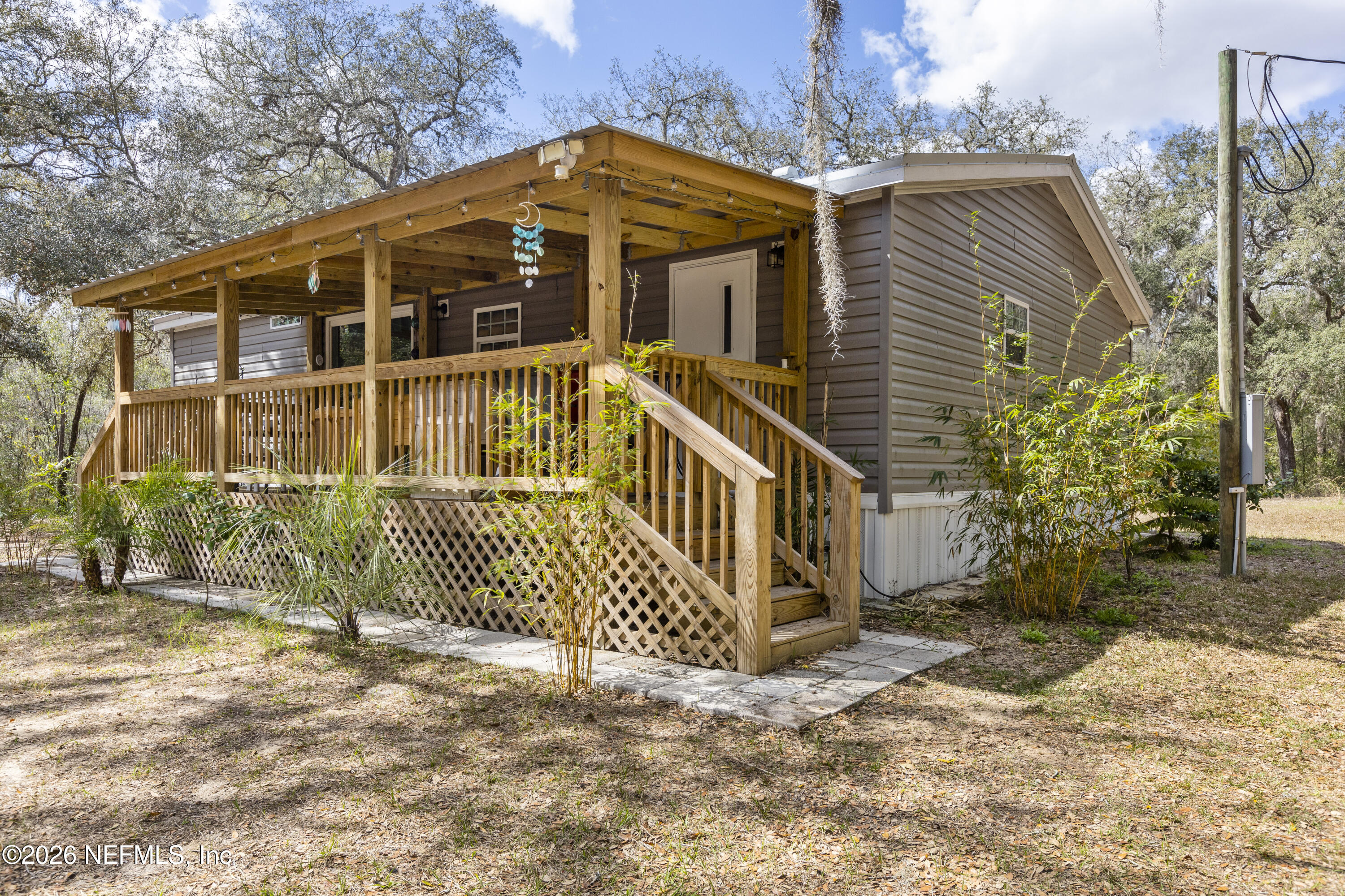 167 West Strickland Road Interlachen, FL 32148 - Photo 54 of 59 a front view of a house with a yard
