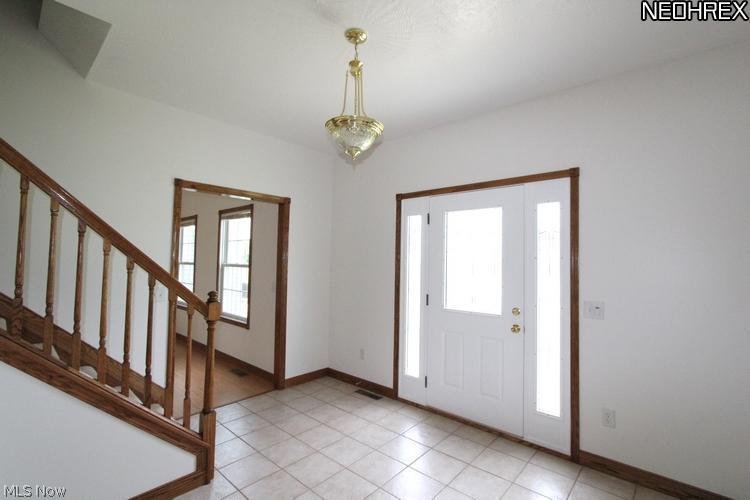 6242 Streeter Road Mantua, OH 44255 - Photo 4 of 24 Natural light filters through this lovely front door
