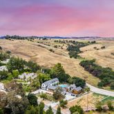 a view of a lake with beach and city