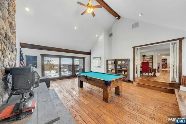 a bedroom with furniture and a window