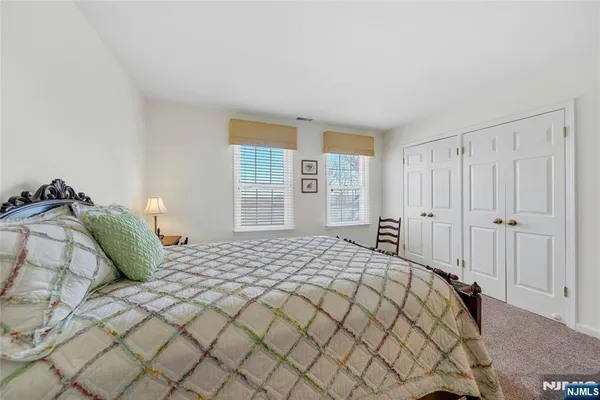 a bathroom with a sink toilet and mirror