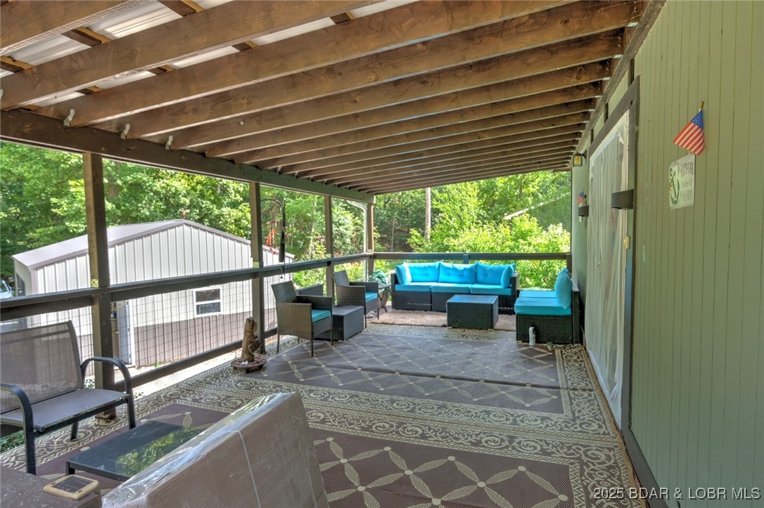 736 Everly Loop Camdenton, MO 65020 - Photo 22 of 28 main level deck area, furniture included
