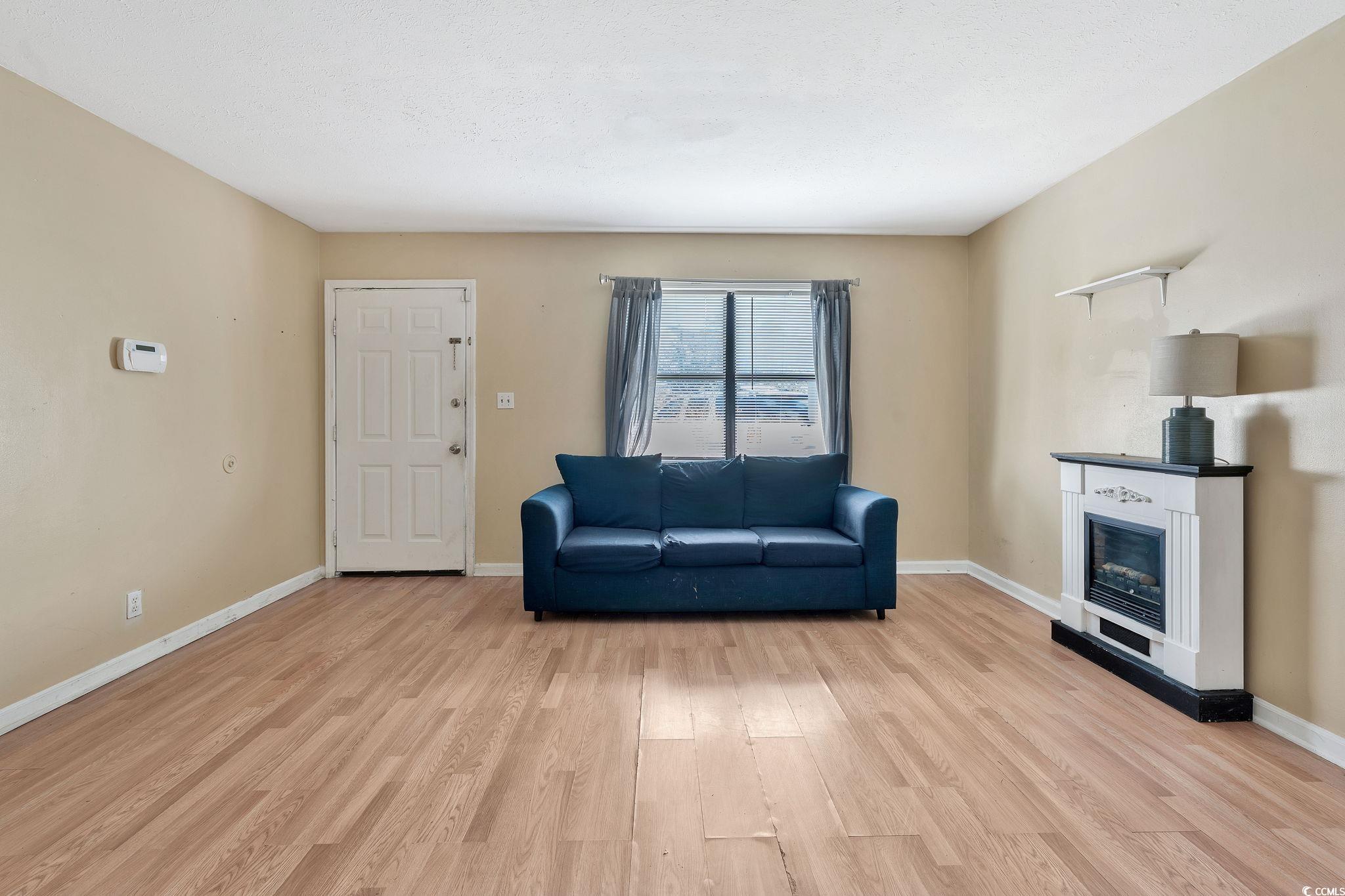 Unfurnished room with light wood-type flooring