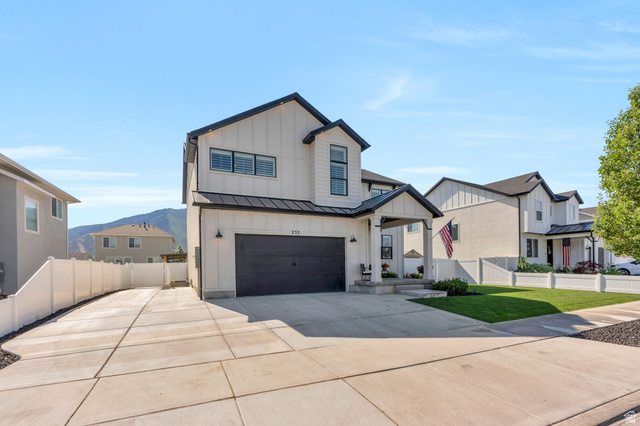 252 North Sunrise Rnch Drive Mapleton, UT 84664 - Photo 4 of 62 Modern farmhouse exterior featuring white board and batten siding with black trim accents