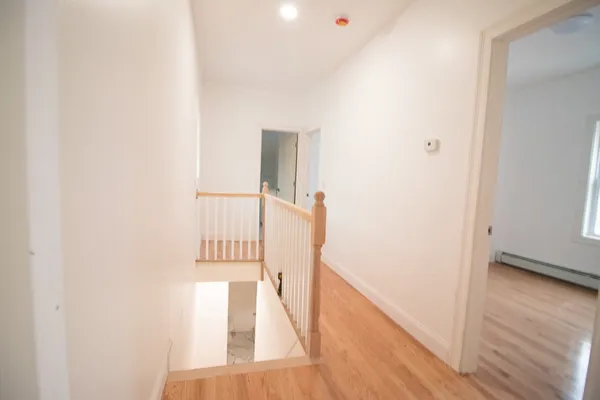 a view of front door with wooden floor