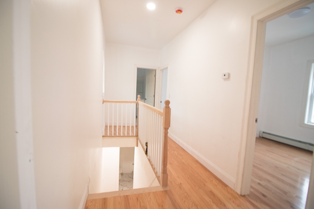 58 Willow Street Lowell, MA 01852 - Photo 14 of 21 a view of front door with wooden floor