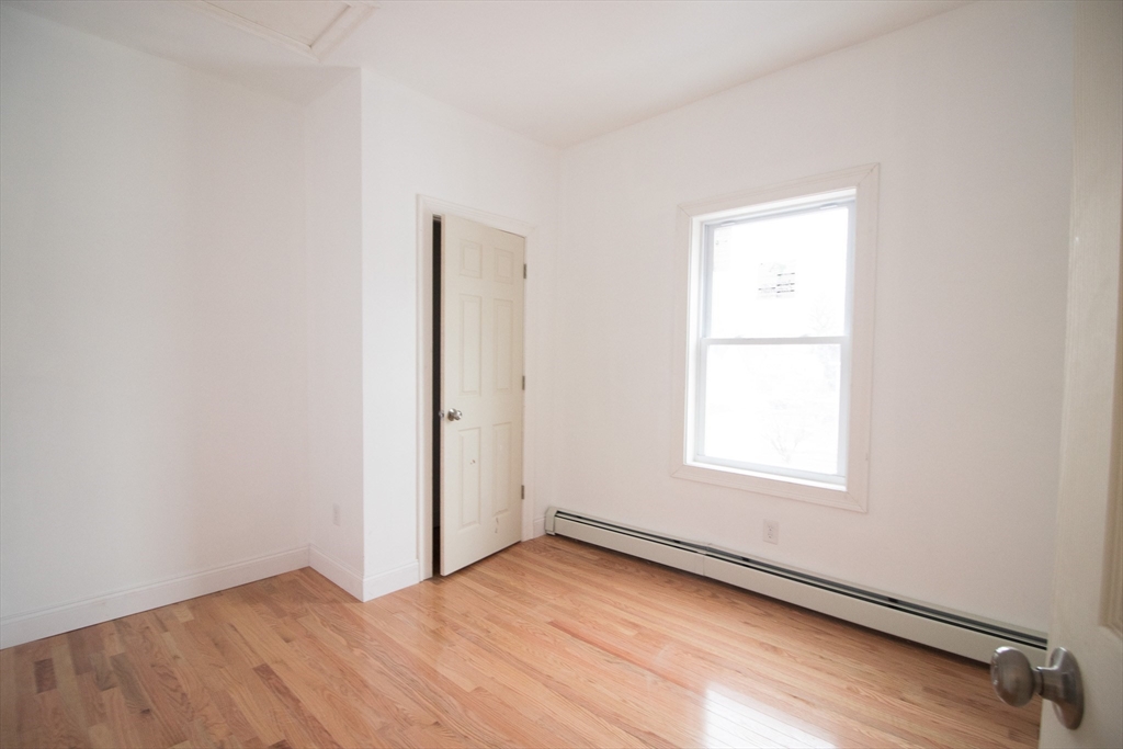 58 Willow Street Lowell, MA 01852 - Photo 15 of 21 an empty room with a window