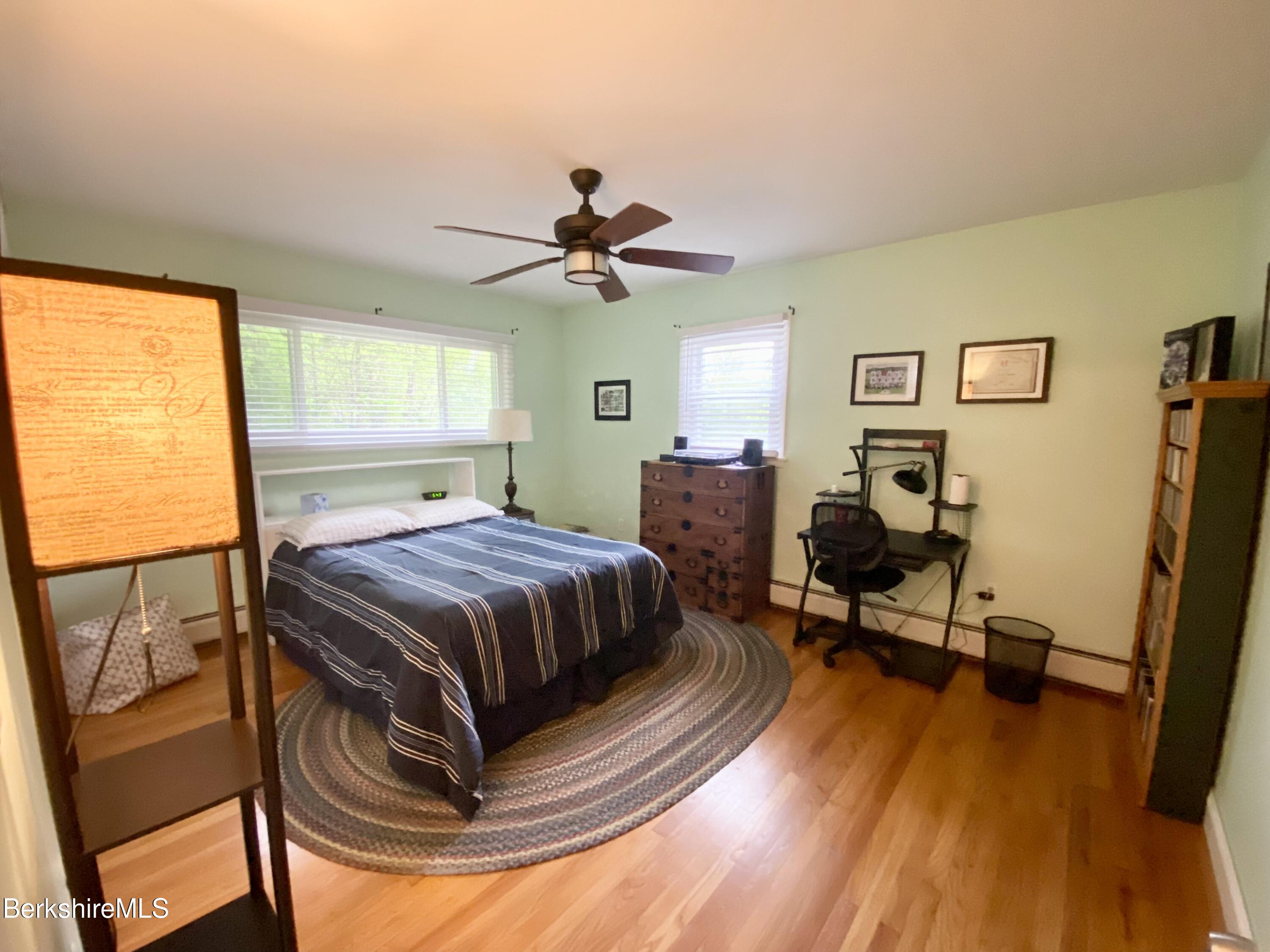 4 Devonshire Drive Cheshire, MA 01225 - Photo 26 of 48 a bedroom with a bed and a chandelier