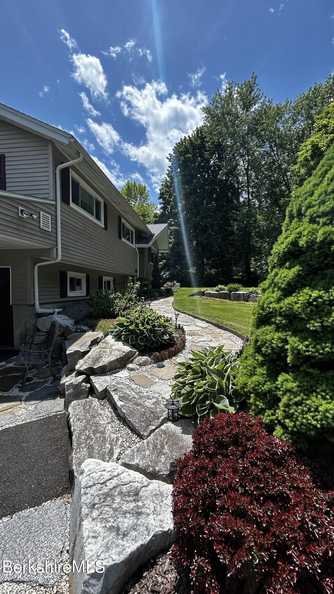 4 Devonshire Drive Cheshire, MA 01225 - Photo 39 of 48 a backyard of a house with a yard and outdoor seating