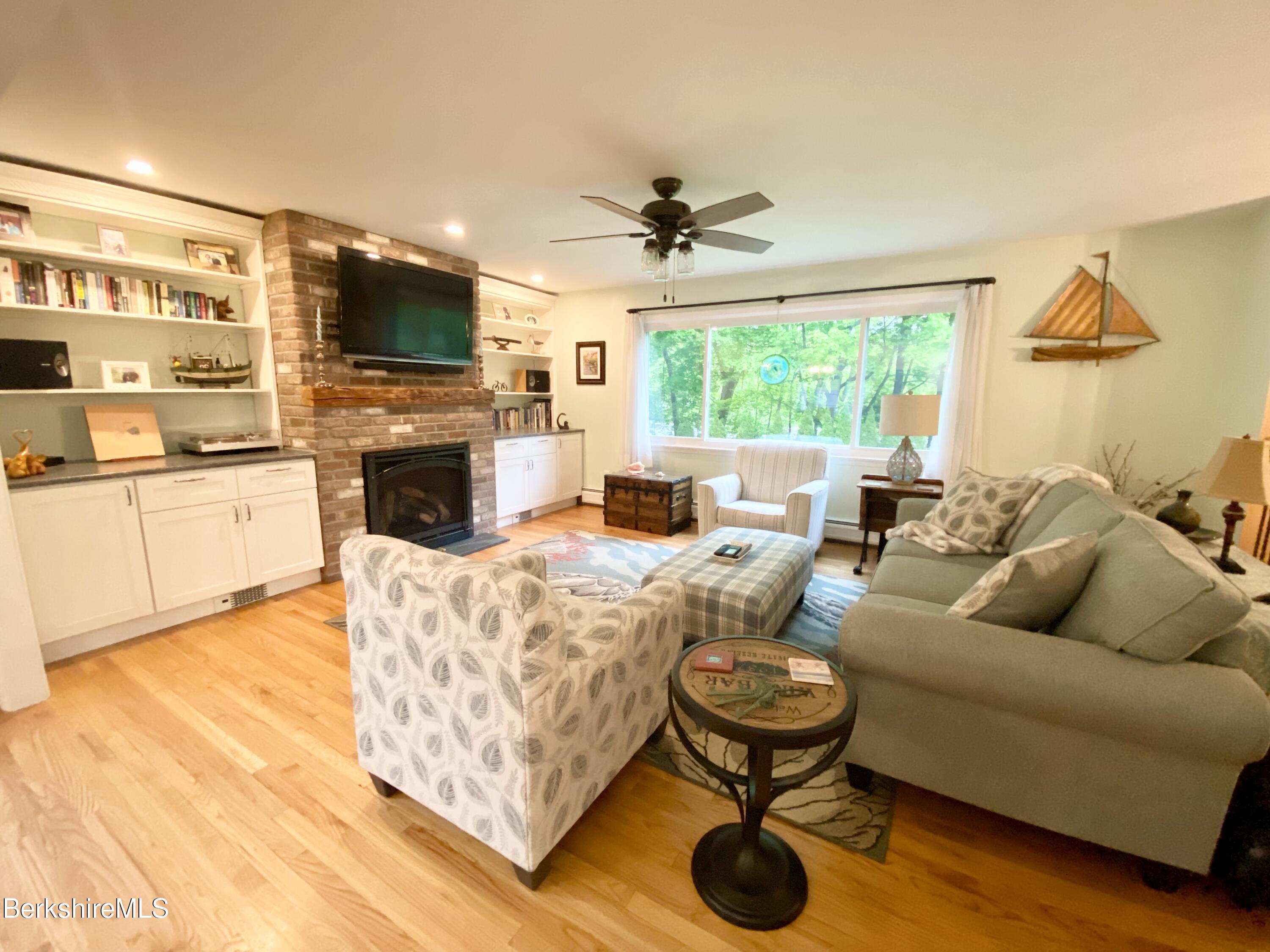 4 Devonshire Drive Cheshire, MA 01225 - Photo 6 of 48 a living room with furniture fireplace and a flat screen tv
