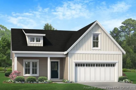 a view of a house with yard and plants