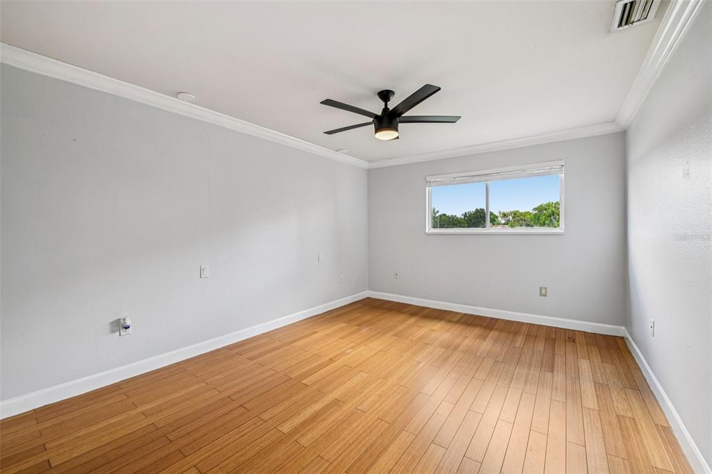 926 Lake Destiny Road, Unit F Altamonte Springs, FL 32714 - Photo 11 of 20 a view of empty room with wooden floor and fan